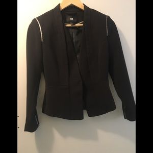 Black blazer with silver threaded detail.